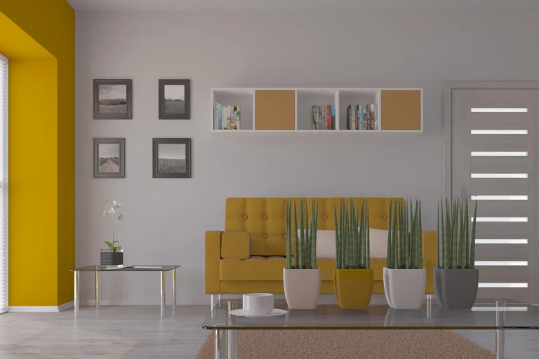 Professional interior designer reviewing architectural plans alongside a beautifully decorated luxury living room, illustrating the difference between interior design and interior decoration.